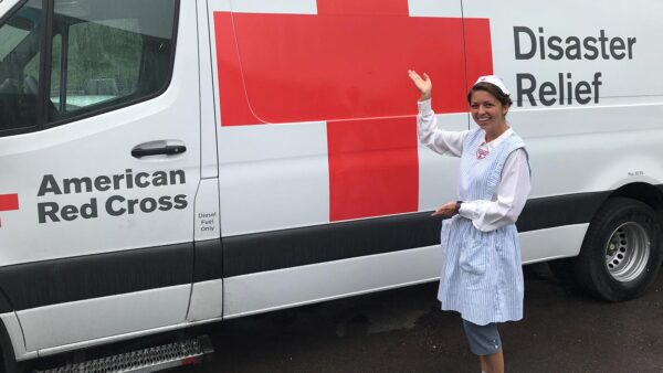 Photo of Amy Leopold with a Red Cross Emergency Response Van