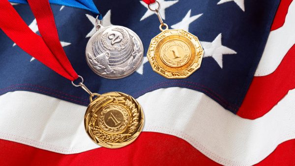 Olympic metals over an American flag.
