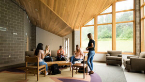 Photo of a group of St. Scholastica students in a dorm common area